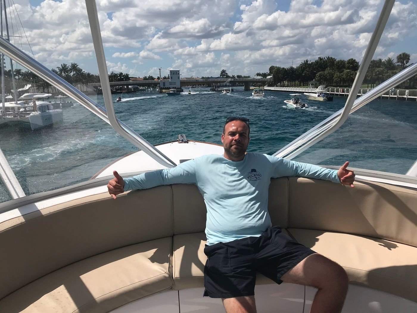 Tim Sherman aboard a boat on a bright day